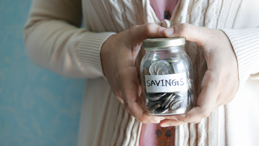 Savings jar holding various coins